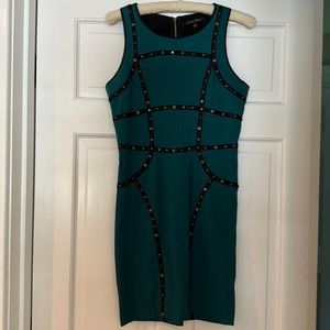 Green dress w low profile studs on black trim
